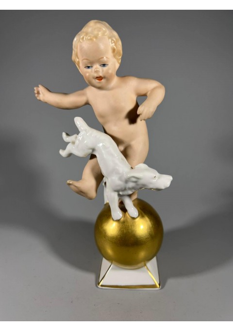 Statulėlė porcelianinė, antikvarinė Berniukas Putti su šunimi. Porceliano manufaktūra Gerold & Co, Bavaria, Vokietija. XX a. vid. 1949 m. Kaina 73