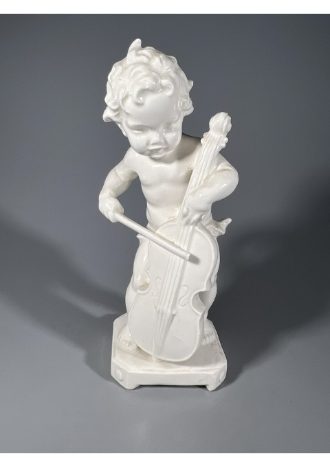 Statulėlė porcelianinė Vaikas groja. Vokietija. Kaina 28