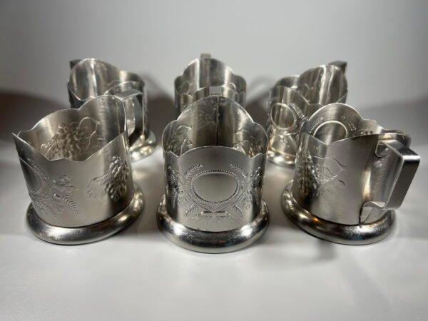 Podstakanikai, stiklinių laikiklai (Podstakannik. Tea glass holder). sovietiniai, tarybinių laikų. Įspaudas: Нержавеющая сталь. Nerūdijantis plienas. 6 vnt. Kaina po 17