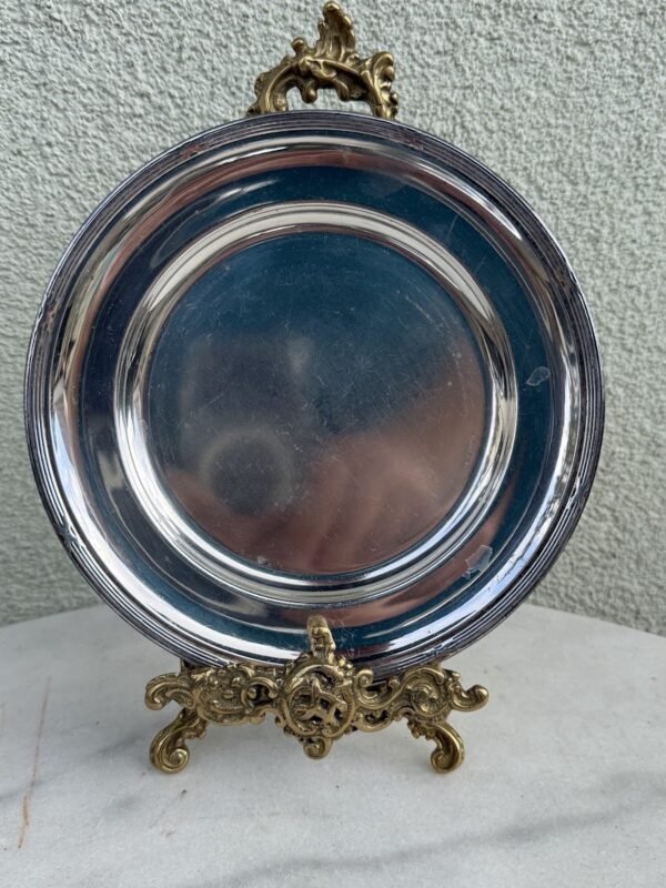 Vintažinė apvali sidabruota metalinė lėkštutė, lėkštė, padėkliukas „Prima N.S.“ (skersmuo 18 cm)